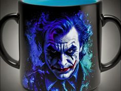 the joker movie character is painted on a black coffee mug with blue interior and handle