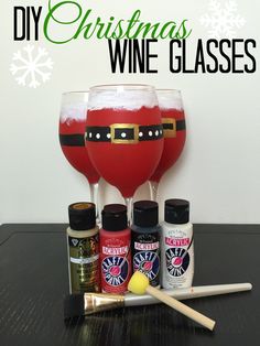 some wine glasses and bottles on a table with snowflakes in the back ground