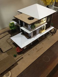 a model of a house on top of a table