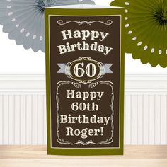 a birthday card with the words happy 60th on it and paper fans in the background