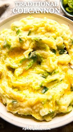 a plate filled with mashed potatoes and broccoli on top of a table