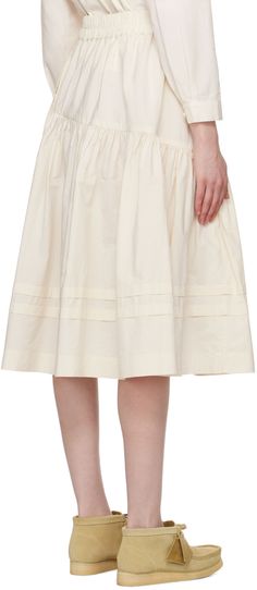 Unbleached organic cotton poplin skirt. · Elasticized waistband · Asymmetric gathered seam · Flared hem · Seam pockets Supplier color: Ecru Cream Tiered Gathered Skirt, Cream Full Cotton Skirt, Cream Cotton Ruffled Skirt, Cream Cotton Full Skirt, Cotton Tiered Skirt With Pleated Waist, Cream Cotton Flared Skirt, Cream Cotton Midi Skirt, Beige Cotton Gathered Skirt, Beige Cotton Gathered Skirt Bottoms