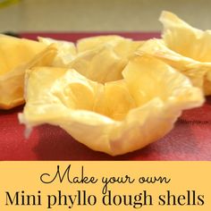 two peeled yellow flowers sitting on top of a red surface with the words make your own mini phylo dough shells