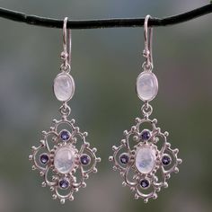 An elegant trellis-like design showcases gemstones like garden blossoms in these earrings from Shubra Singh. The artisan crafts the earrings from polished sterling silver adding cabochons of rainbow moonstone and petite round faceted iolite..925 Sterling silver Stylish Earrings, Garden Trellis, Moonstone Jewelry, Gems Jewelry, Jewelry Inspo, Hook Earrings, Jewelry Gift Box, Rainbow Moonstone, Jewelry Designs