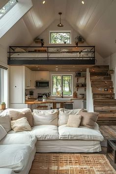 a living room filled with furniture and a loft