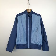 Beautiful vintage light jacket. 2 tones blue (light and navy). 80s/90s style, worker style. Zipped pockets hidden in a box pleat, very cool! Workwear & sportswear, very stylish. MATERIALS & CONDITION Material is 65% polyester, 35% cotton with 100% nylon lining. Condition is : very very good vintage condition -- only small light dark traces on the front, see last photo MEASUREMENTS Size is M (refer to measurements and photos with model) Do not hesitate to DM if you have any questions ! Shoulder s Blue Spring Windbreaker For Work, Casual Blue Track Jacket For Work, Blue Casual Track Jacket For Work, Blue Sporty Outerwear For Work, Casual Blue Windbreaker For Work, Casual Blue Windbreaker With Zipper, Blue Retro Track Jacket For Spring, Casual Blue Track Jacket With Zipper Closure, Casual Blue Windbreaker With Zipper Closure