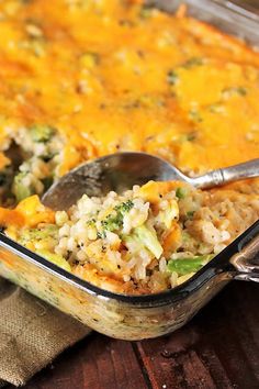 a casserole dish with broccoli, rice and other vegetables in it