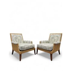 two chairs sitting next to each other on a white background