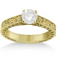 an antique style diamond engagement ring with filigrees