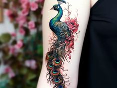 a woman with a peacock tattoo on her arm