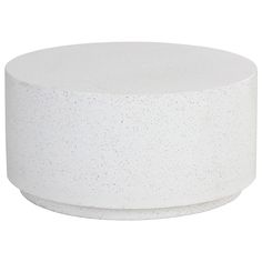 a white round table with speckles on the top and bottom, against a white background