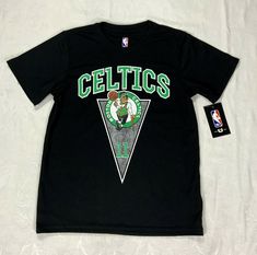 Up for sale is an awesome NWT Boys' or Girls' NBA Boston Celtics Black T-Shirt in Size Medium (10-12). A perfect gift for your guy or gal who loves Kyrie Irving, #11! Soft, comfortable, smooth, very lightweight material with stretch.   Black in color with the Celtics name and icon in Celtic green and white. IRVING printed on back of tee with the number 11 highlighted. Short sleeves with a crew neckline.  Waist measurement: 13"  (26" waist). Inseam: 11". Length of Shorts: 21". Made of 100% Polyes The Number 11, Nba Boston Celtics, Celtic Green, Number 11, Kyrie Irving, Waist Measurement, Boston Celtics, Black T Shirt, Green And White