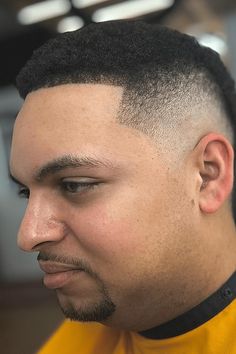 This stylish high fade haircut clearly shows the difference between the much longer hair on top compared to the closely cut hair on the sides. The hair on top is messy and thick, looking very different from the shaved down sides. The straight line where the hair is cut above the forehead gives it a clear and sharp edge that makes the overall - Click to see more of Sharp and Stylish: 28 High Fade Haircuts for Men and follow us for more hairstyle ideas. // Photo Credit: Instagram @flick.van.exel