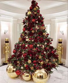 a christmas tree with red and gold ornaments