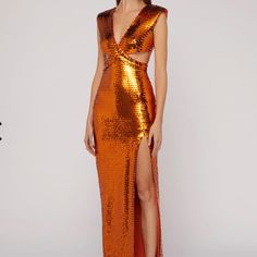 Long Dress With V-Neck At The Front And Back, Characterized By A Particular Interwoven Bodice With Small Holes On The Hips. Special Features Of The Garment Are The All-Over Embroidered Sequins, Which Create An Elegant Play Of Light And Shadow. The Textured Shoulders And Sensual Slit Decorate The Dress. The Style Is That Of The Party Or A Ceremony. Sku:73ajo486n0158511 Materials And Care Made Entirely In Italy. Composition: 90%Polyester, 10%Elastam. Dry Clean In A Specialist Center. Size 40 Itali Phoenix Inspired Gown, Nye Dress, Sequin Formal Dress, Silver Dress, Orange Dress, Light And Shadow, Sequin Dress, Holiday Party, Burnt Orange