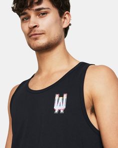 Super-soft, cotton-blend fabric provides all-day comfort|Ribbed collar|Generous dropped armholes for full range of motion Athleisure Cotton Tank Top With Graphic Print, Sporty Cotton Crew Neck Vest, Black Sleeveless Relaxed Fit Activewear, Casual Crew Neck Sports Vest, Urban Crew Neck Cotton Tank Top, Crew Neck Cotton Tank Top For Sports, Black Sleeveless Activewear With Graphic Print, Casual Cotton Muscle Tee For Workout, Urban Cotton Crew Neck Tank Top