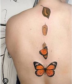 the back of a woman's upper body with three butterflies on her left side