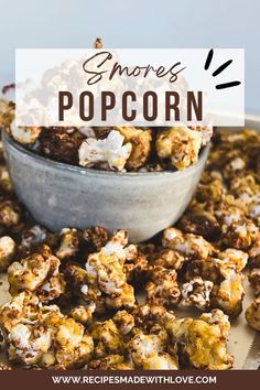 a bowl filled with popcorn sitting on top of a table next to other food items