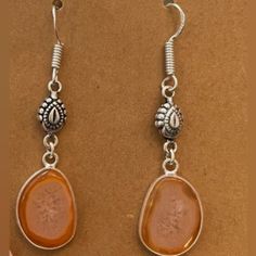 Orange Sliced Agate Gemstone Earrings With Hypoallergenic Sterling Silver Ear Wires. 2" Long, Lightweight All Jewelry Is New And Comes In Jewelry Pouch Or Gift Box. Bundle 4 Or More Items Receive Free Shipping. Other Listings, Chic, Boho, Classy, Glass, Beads, Sterling Silver, Stainless Steel, Tropical, Oceanic, Coastal, Traditional, Rainbow, Colors, Blue, Green, Red, Black, Silver, Orange, Pink, Purple, Yellow, Clear, Modern, Gothic, Natural, Stone, Crystal, Gemstone, Durable, Unique, Gift, Nat Silver Agate Jewelry, Pierced Silver Agate Jewelry, Nickel Free Carnelian Dangle Earrings, Amber Teardrop Earrings With Natural Stones, Silver Carnelian Jewelry With Ear Wire, Adjustable Carnelian Earrings With Natural Stones, Nickel Free Agate Dangle Earrings, Silver Teardrop Carnelian Jewelry, Silver Carnelian Teardrop Jewelry