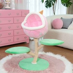 a pink and green chair sitting on top of a white rug