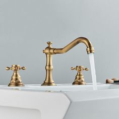 two faucets running water in a bathtub