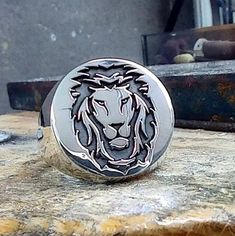 ✨ A lovely twist on an all-time favorite Silver Lion Signet Ring. This jewelry piece is engraved with a lion's head. The lion is a symbol of loyalty and courage. This is also a stylish piece to give as a Leo zodiac ring. * A unique and minimal lion signet ring that is perfect for both men and women. * Special engraving technique using which create the appearance of images of your choice. * On this ring, not only the lion motif, but also the letters, numbers, symbols, logos, etc. you want. All customization is possible. Do not hesitate to contact us for this. We respond quickly to your messages. * The Silver Lion Head Signet Ring for Men is a good gift for your husband, dad, grandpa, boyfriend, father, brother or yourself on Christmas, Birthday, Anniversary, Fathers Day, Valentine's Day. __ Lion Signet Ring, Mens Signet Ring, Signet Ring For Men, Loyalty Symbol, Zodiac Rings, Lion Ring, Numbers Symbols, Head Ring, Ring Mens