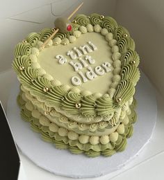 a heart shaped cake sitting on top of a table