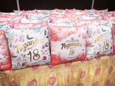 several pillows with numbers on them sitting on a table