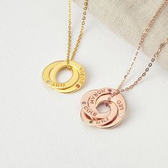 "**DAINTY NECKLACE FOR MOMS WITH ENGRAVED NAMES & BIRTHSTONES, made from sterling silver with silver, gold plated or rose gold plated finishing color. This 2-4 interlocking-ring necklace is a special gift for moms & grandmas. Each of these rings can be personalized with a kid name or birthstone. I T E M ∙ D E T A I L S * Word limits: ONE name + birthstone per ring * By default, silver items comes with BLACK engraving and gold-plated item comes with CLEAR engraving. * Material: Sterling silver * Finishing color: Silver, 18k Gold or Rose Gold. * Dimensions: Pendant height: 5/8 Inches; Pendant width: 5/8 Inches **The text will appear in the case and style seen in the display picture H O W ∙ T O ∙ O R D E R * Select your necklace length * Choose your finishing color and the number of rings fro Sterling Silver Round Necklace For Christmas, Sterling Silver Personalized Jewelry Gift For Christmas, Sterling Silver Jewelry For Birthday And Christmas, Sterling Silver Jewelry For Personalized Christmas Gift, Necklace With Kids Names, Special Gifts For Mom, Interlocking Ring, Necklace For Mom, Silver Items