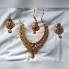 Beautiful, Classy Indian Necklace With Earrings And Forehead Chain(Jewelry). Golden Color With Fushia/ Hot Pink Colored Stones. Pink Fusion Jewelry For Formal Occasions, Temple Jewelry With Intricate Design In Pink, Pink Temple Jewelry With Intricate Design, Elegant Pink Necklace For Festivals, Fusion Gold Necklaces With Matching Earrings, Pink Elegant Necklace For Festivals, Ruby Necklace With Matching Earrings For Wedding, Pink Jewelry For Formal Festive Occasions, Pink Formal Jewelry For Festive Occasions