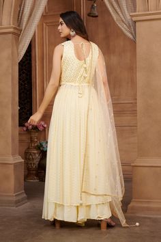 Maitri Georgette Tiki Pearl Embroidered Naira Cut Palazzo Suit. Readymade premium georgette fabric Enhanced with thread & tiki embroidery work Comes with dupatta, palazzo pants Designed with two side slits Comes with waist belt Comes with optional long sleeves fabric. Look your best in this Maitri palazzo suit! Crafted from georgette fabric with pearl embroidery and a Naira cut, this stylish outfit adds sophistication to any wardrobe. The lasting quality of the fabric ensures you'll be wearing t Floor-length Embroidered Georgette Sets, Semi-stitched Full Length Sets With Resham Embroidery, Designer Wear Floor-length Chikankari Embroidery Sets, Designer Chikankari Embroidery Floor-length Set, Embroidered Semi-stitched Sets Maxi Length, Eid Resham Embroidery Full Length Sets, Full-length Anarkali Georgette Set, Embroidered Georgette Set In Maxi Length, Yellow Georgette Palazzo Set For Reception