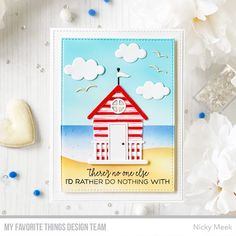 a card with a beach hut on it