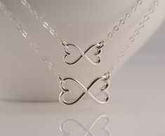 "Mother daughter necklace set. Mother daughter heart infinity necklace, Mother Daughter necklace, Heart Infinity necklaces, Love Forever This necklace set is a great gift for mothers and daughters. These necklaces are simple and they can be worn on any occasion. The necklaces will arrive in a nice gift box. If you prefer the necklaces be shipped in separate boxes, please let me know. Mother's necklace: Sterling silver heart infinity pendant is about 3/4\" x 7/16\". Sterling silver chain is 18\" Mother Daughter Necklaces Set, Mother Daughter Jewelry, Mother Daughter Necklace, Infinity Pendant, Infinity Heart, Daughter Necklace, Infinity Necklace, Mothers Necklace, Necklace Heart