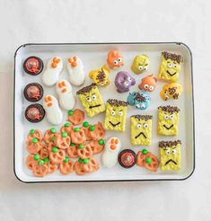 a white tray filled with halloween treats on top of a table