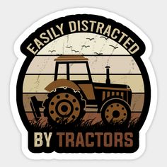 a tractor with the words easily distracted by tractors on it's front and side