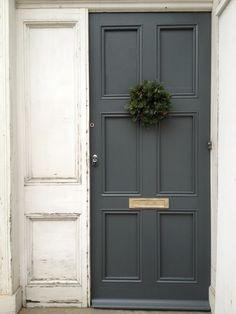 a door with a wreath on it and the words downpipe written in front of it