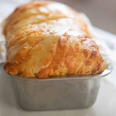 a close up of a pastry in a pan on a table