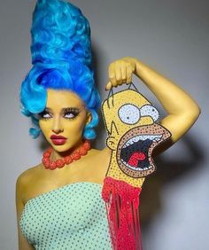 a woman with blue hair and makeup is wearing a costume made to look like the simpsons character