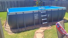 an above ground swimming pool in a backyard