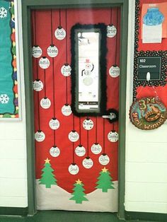 a classroom door decorated with christmas decorations and writing on the front, along with an iphone