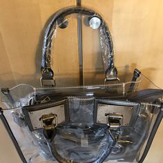 This satchel and tote handbag is 2-in-1. It's a transparent satchel tote with a complimentary removable shoulder bag. This bag is awesome! If you love chic bags, this is the perfect bag for you!

2-day processing. Shipped in 4-7 days. Trendy Clear Shoulder Bag Satchel, Clear Satchel Bag For Travel, Trendy Clear Satchel For Travel, Trendy Clear Travel Satchel, Clear Rectangular Bag With Zipper Closure, Clear Tote Shoulder Bag With Removable Pouch, Clear Shoulder Bag With Removable Pouch For Shopping, Trendy Shoulder Satchel With Clear Strap, Trendy Clear Tote Bag