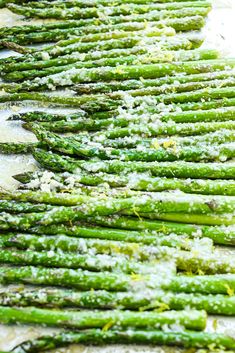 asparagus with parmesan cheese and seasoning sprinkled on top