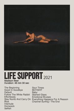 a woman laying on the ground in front of a black background with text that reads life support