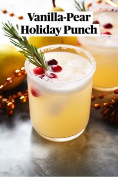 two glasses filled with holiday punch and garnished with pomegranates