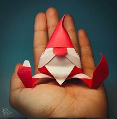 A delightful origami gnome by Riccardo Foschi Shell Origami, Origami Santa, Paper Folding Crafts, Origami Ornaments, Origami And Kirigami, Origami Patterns, Folding Origami, Instruções Origami, Origami Paper Art