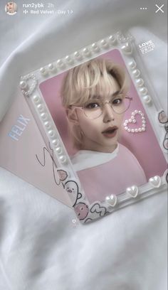 an image of a woman with pearls on her head and eyeglasses in front of a white sheet