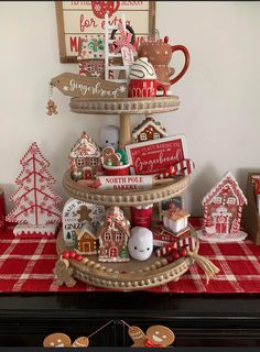 there is a christmas tree made out of cookies and other holiday decorations on the table