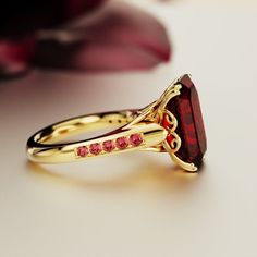 Limited Time Offer: $80 OFF with a FREE Giftbox Immerse yourself in the enchanting allure of the Red Dream ring, a true work of art designed to add a touch of magic to your life. It's not just jewelry; it's an experience—a symbol of your unique elegance and refined style. Details Material: 18k Gold Vermeil Stone: Simulated Ethical Ruby. Materials Lasting Shine: Crafted from high-quality 18k Gold Vermeil, this ring promises a lifetime of shine and durability, ensuring it stays as stunning as the Gold And Red Jewelry, Ruby Ring Designs, Faberge Jewelry, January Birthstone Jewelry, Feel Empowered, Red Jewelry, January Birthstone, Refined Style, Dream Ring