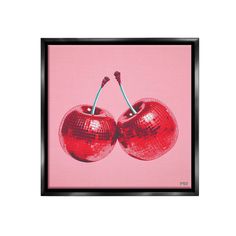 two cherries on a pink background in a black frame