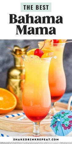 two glasses filled with orange juice and topped with a cherries on the rim, next to an orange slice